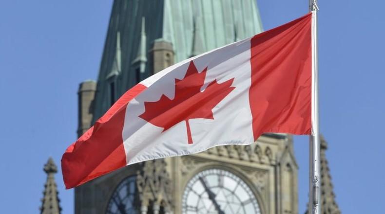 Canadian flag over Parliament