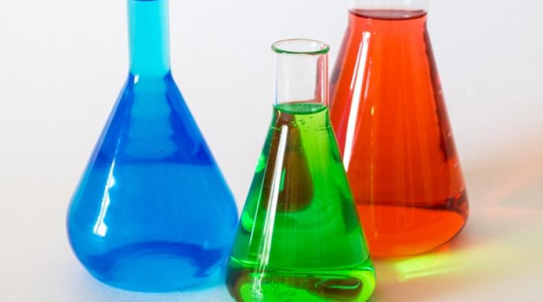 test tubes and beakers full of brightly colored liquid