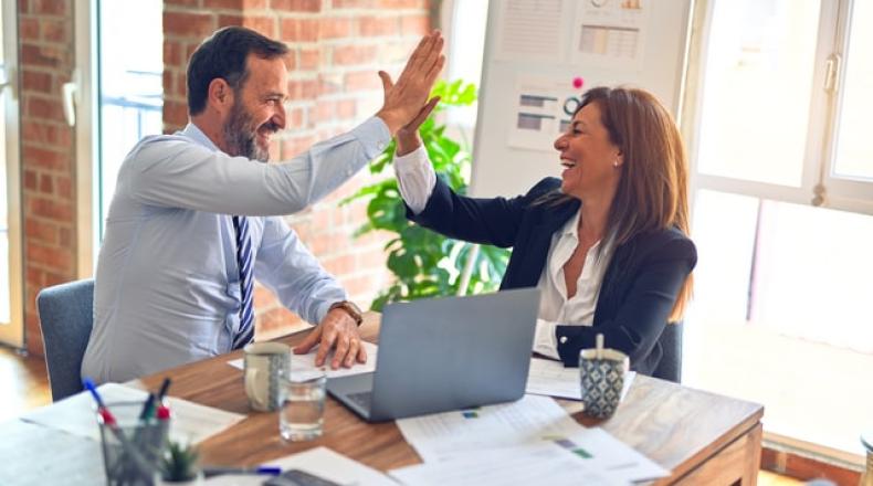 two business people high-fiving