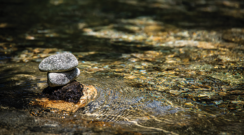 stack of rocks in a creek