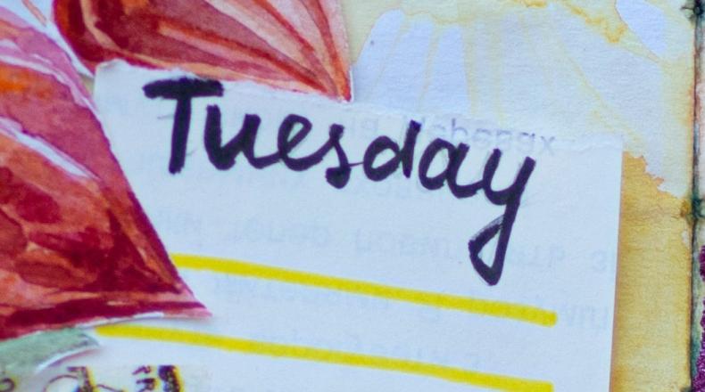 word Tuesday above yellow lines