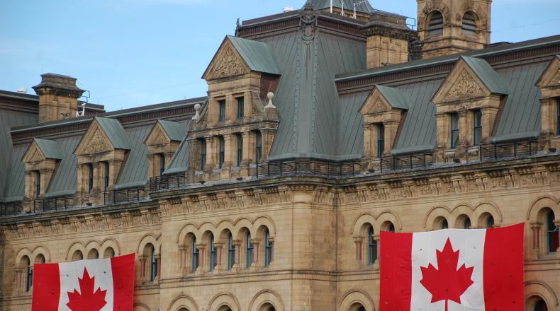 building displaying two Canadian flags