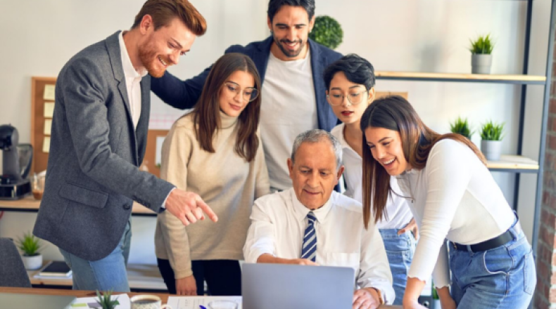 People gathered around a computer