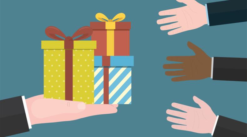 Gift boxes in hand. Concept of giving and receiving gifts