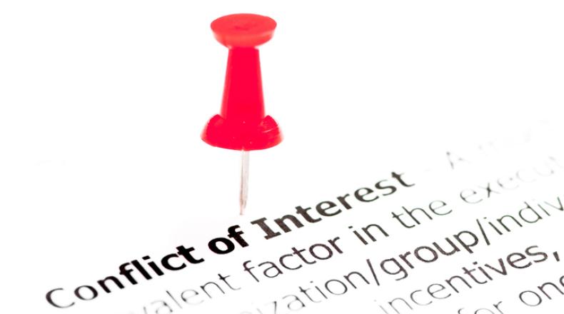 Closeup shot over words Conflict of Interest on paper stock photo