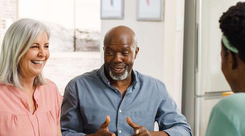 three individuals having a pleasant conversation