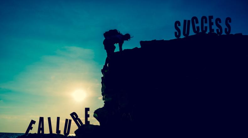 Business success and goal concept. Silhouette climber on the cliff. stock photo
