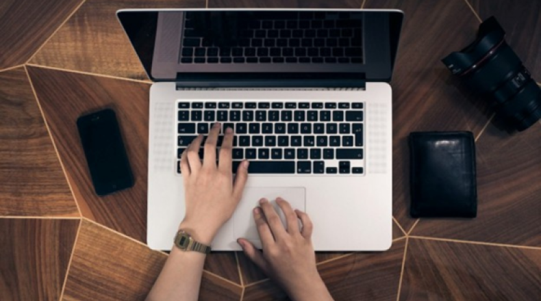 Person typing on a computer