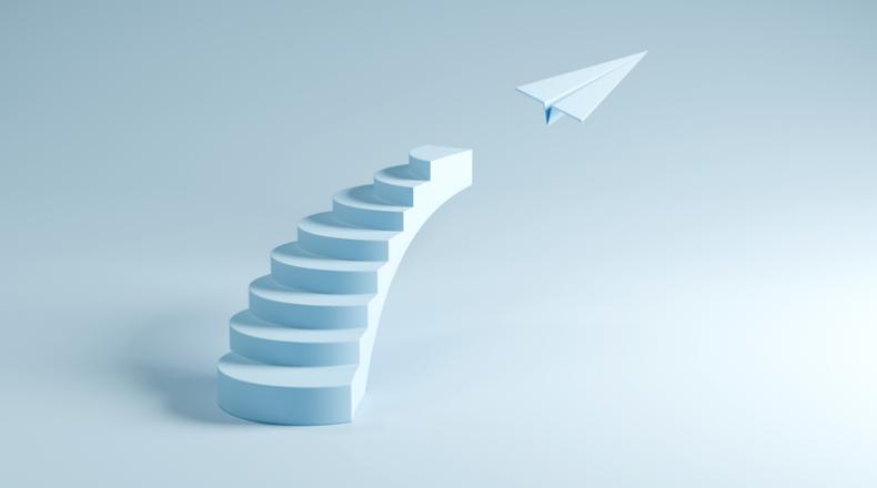 Stairs Leading to Flying Paper Plane - Success, Growth