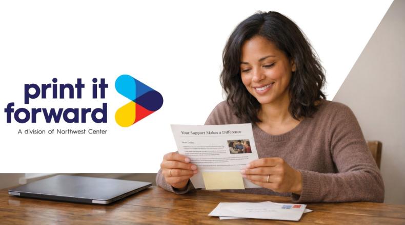 A woman looking at a piece of direct mail fundraising efforts