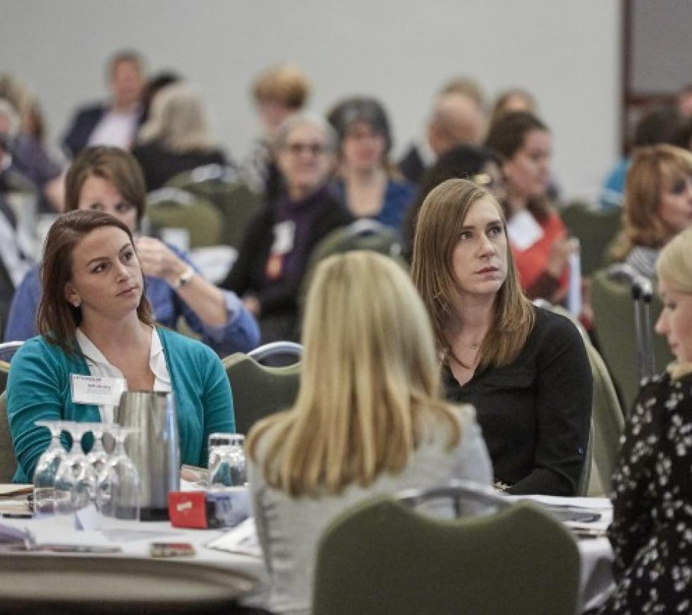 Attendees at a chapter conference listen to a speaker