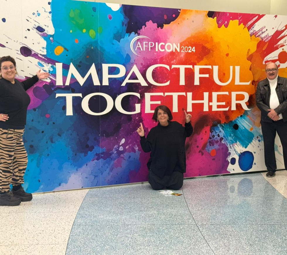 Attendees posing in front of the 2024 ICON branding