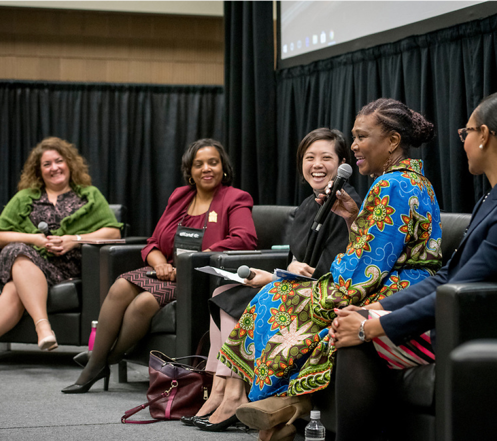 women sitting for a panel discussion