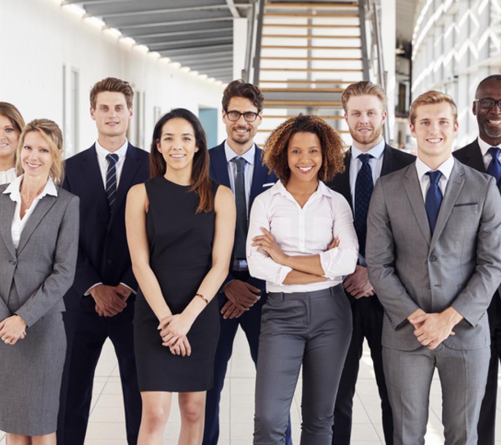 Office workers in a modern lobby, group portrait stock photo