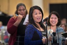 Woman asking a question during a course