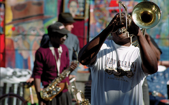 Man playing a trombone in a band in New Orleans