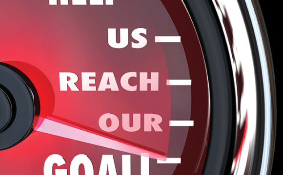 Needle on a gauge that says help us reach our goal