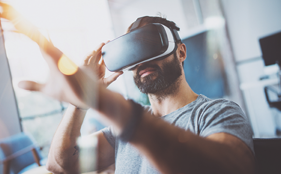 man using a virtual reality device