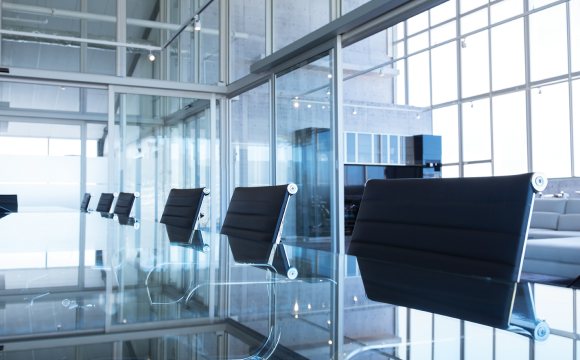 close up of a conference room with empty chairs and a table