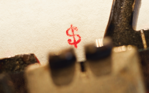 typewriter with a dollar sign on paper
