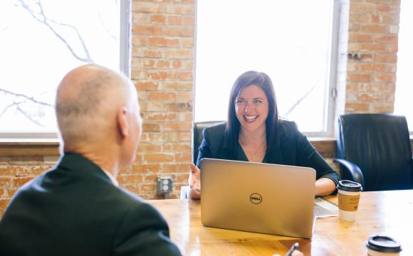 smiling woman and man working