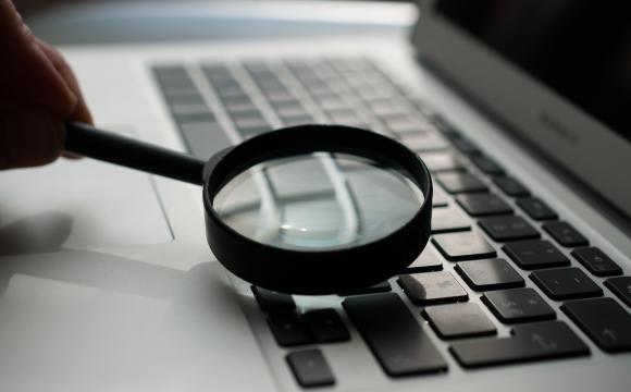magnifying glass on a computer keyboard