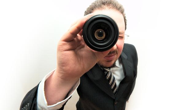 man in a suit with spyglass 