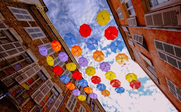 brightly colored umbrellas against the sky