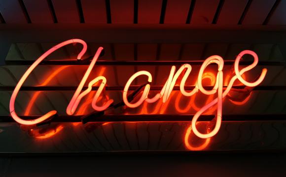 neon sign saying change