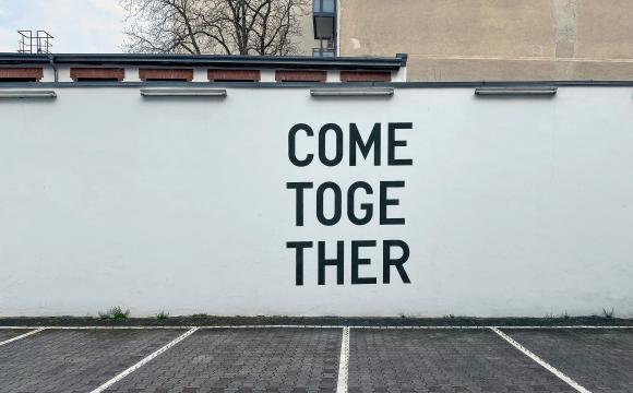 a mural reading "come together"