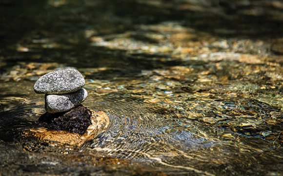 stack of rocks in a creek