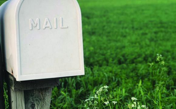 mailbox with a field in background