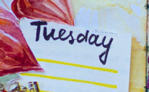 word Tuesday above yellow lines