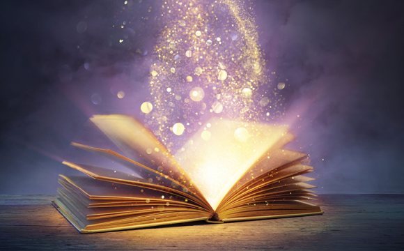magic book with light against a dark background
