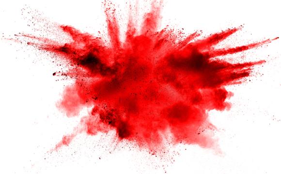Abstract red dust splattered on white background. Red powder explosion on white background.
