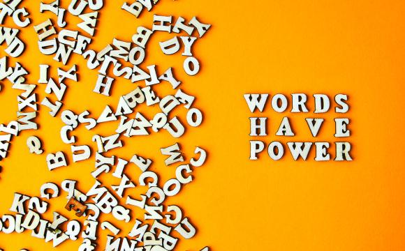 words have power on an orange background