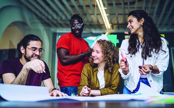 group of young people laughing and talking