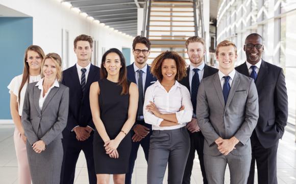 Office workers in a modern lobby, group portrait stock photo
