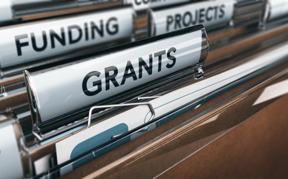 file folders showing words grants, projects and funding