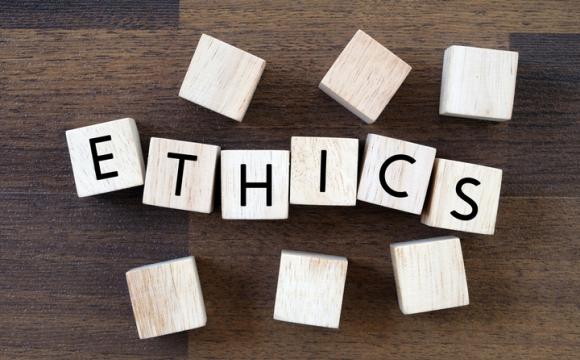 Ethics word on wooden block background