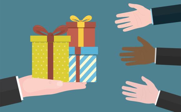 Gift boxes in hand. Concept of giving and receiving gifts