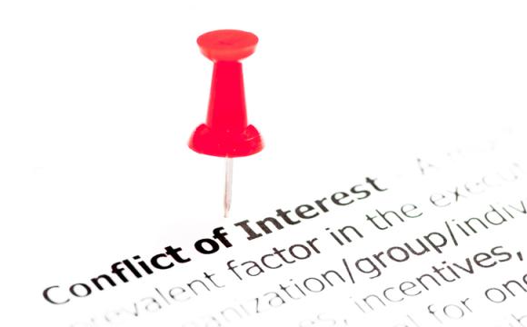Closeup shot over words Conflict of Interest on paper stock photo