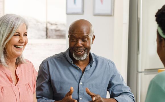 three individuals having a pleasant conversation