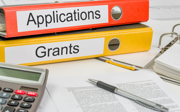 Binders that say grants and applications