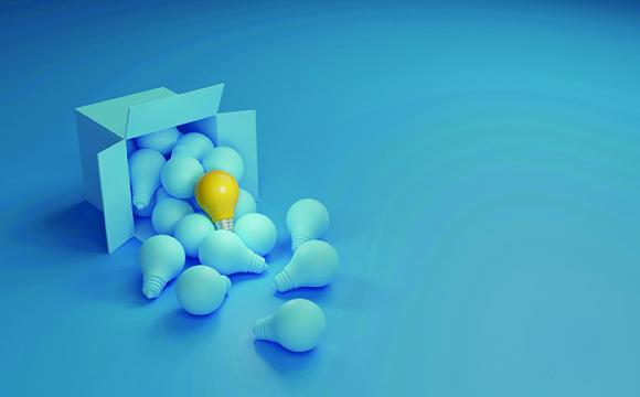 blue lightbulbs with one yellow bulb on a blue background