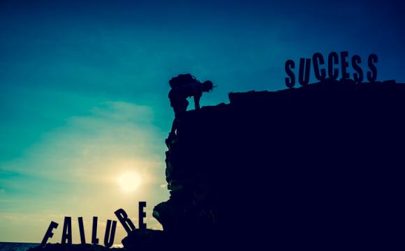 Business success and goal concept. Silhouette climber on the cliff. stock photo