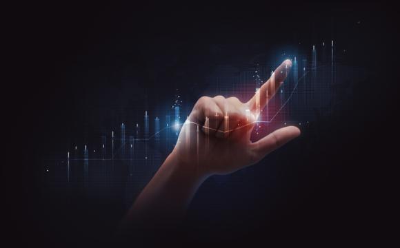 Businessman pointing finger to stock market finance graph chart