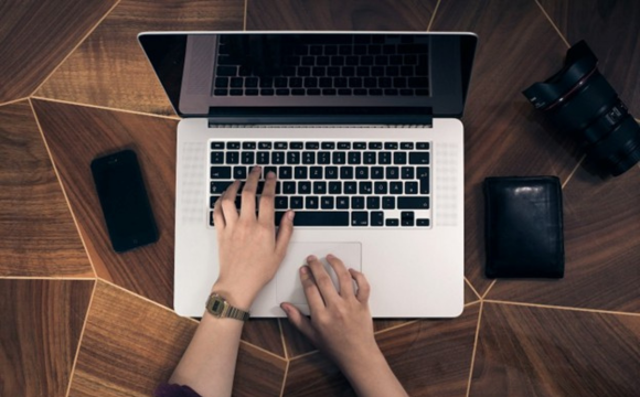 Person typing on a computer