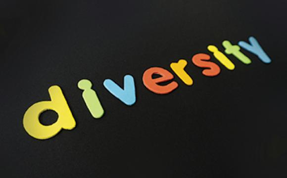 the word diversity in different colors with a black background