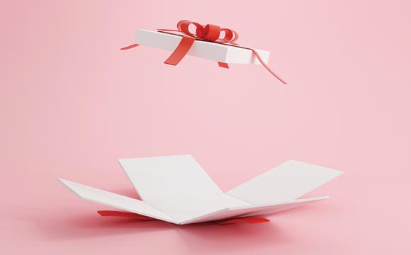 pink background with an open white box and a red box on a white box lid
